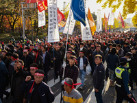 Hundreds of farmers march through the streets of Yeouido as part of the Farmers' General Rally for Agricultural Reform, organized by the Kor...