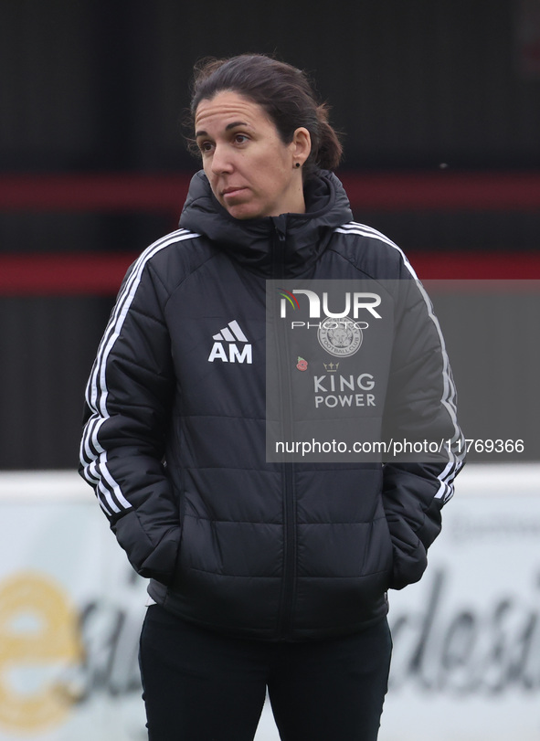 Amandine Miquel, manager of Leicester City, participates in the pre-match warm-up during the Barclays FA Women's Super League soccer match b...