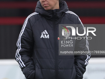 Amandine Miquel, manager of Leicester City, participates in the pre-match warm-up during the Barclays FA Women's Super League soccer match b...