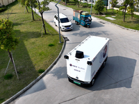 An unmanned delivery vehicle with the largest warehouse capacity operates for the first time at the sorting center of Yancheng Yidatong Logi...