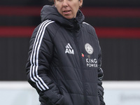 Amandine Miquel, manager of Leicester City, participates in the pre-match warm-up during the Barclays FA Women's Super League soccer match b...