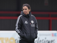 Amandine Miquel, manager of Leicester City, participates in the pre-match warm-up during the Barclays FA Women's Super League soccer match b...