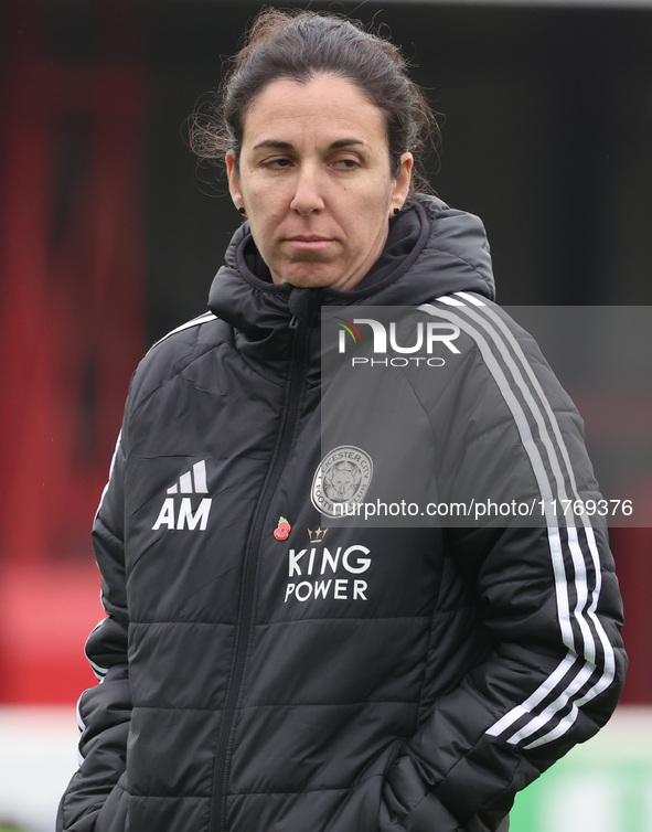 Amandine Miquel, manager of Leicester City, participates in the pre-match warm-up during the Barclays FA Women's Super League soccer match b...