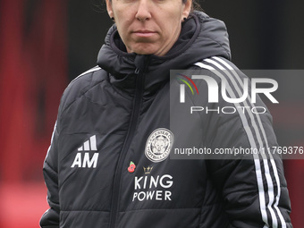 Amandine Miquel, manager of Leicester City, participates in the pre-match warm-up during the Barclays FA Women's Super League soccer match b...