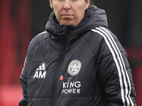 Amandine Miquel, manager of Leicester City, participates in the pre-match warm-up during the Barclays FA Women's Super League soccer match b...