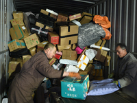 Staff work on an assembly line at the sorting center of Yancheng Yidatong Logistics Co LTD in Dafeng district of Yancheng City, East China's...