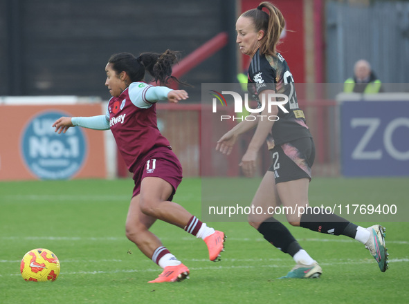 In Dagenham, England, on November 10, 2024, Manuela Pav of West Ham United WFC and Courtney Nevin (on loan from Hammarby) of Leicester City...