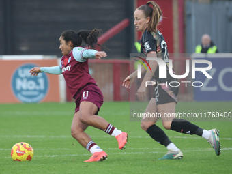 In Dagenham, England, on November 10, 2024, Manuela Pav of West Ham United WFC and Courtney Nevin (on loan from Hammarby) of Leicester City...