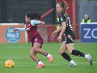 In Dagenham, England, on November 10, 2024, Manuela Pav of West Ham United WFC and Courtney Nevin (on loan from Hammarby) of Leicester City...