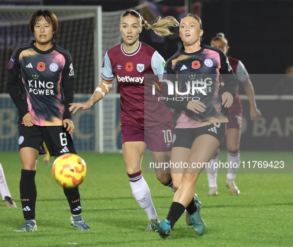 In Dagenham, England, on November 10, 2024, from left to right, Saori Takarada of Leicester City Women, Dagny Brynjarsdottir of West Ham Uni...