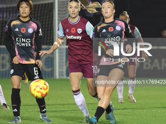 In Dagenham, England, on November 10, 2024, from left to right, Saori Takarada of Leicester City Women, Dagny Brynjarsdottir of West Ham Uni...