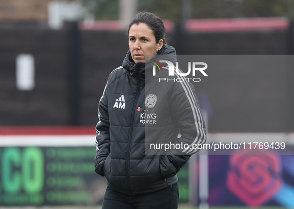 Amandine Miquel, manager of Leicester City, participates in the pre-match warm-up during the Barclays FA Women's Super League soccer match b...