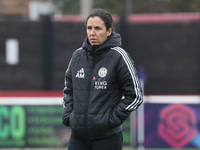 Amandine Miquel, manager of Leicester City, participates in the pre-match warm-up during the Barclays FA Women's Super League soccer match b...