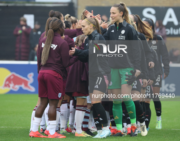 In Dagenham, England, on November 10, 2024, from left to right, Janice Cayman of Leicester City Women and Janina Leitzig stand before kick-o...