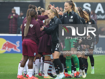 In Dagenham, England, on November 10, 2024, from left to right, Janice Cayman of Leicester City Women and Janina Leitzig stand before kick-o...