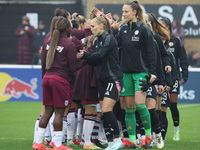 In Dagenham, England, on November 10, 2024, from left to right, Janice Cayman of Leicester City Women and Janina Leitzig stand before kick-o...