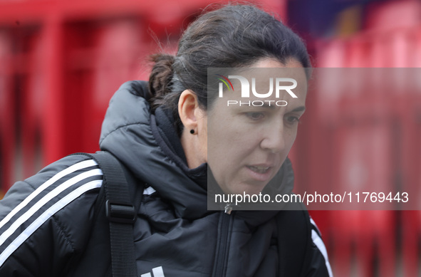 Amandine Miquel, manager of Leicester City, participates in the pre-match warm-up during the Barclays FA Women's Super League soccer match b...