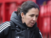 Amandine Miquel, manager of Leicester City, participates in the pre-match warm-up during the Barclays FA Women's Super League soccer match b...