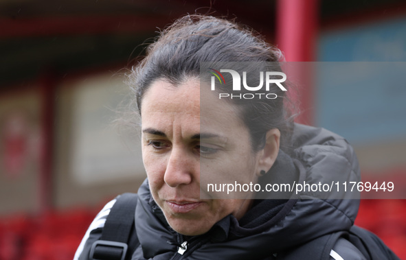 Amandine Miquel, manager of Leicester City, participates in the pre-match warm-up during the Barclays FA Women's Super League soccer match b...