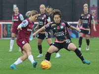 Katrina Gorry of West Ham United WFC and Yuka Momiki of Leicester City Women are in action during the Barclays FA Women's Super League socce...