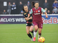 Lime Mengwen, on loan from Brighton & Hove Albion, of West Ham United WFC plays during the Barclays FA Women's Super League soccer match bet...