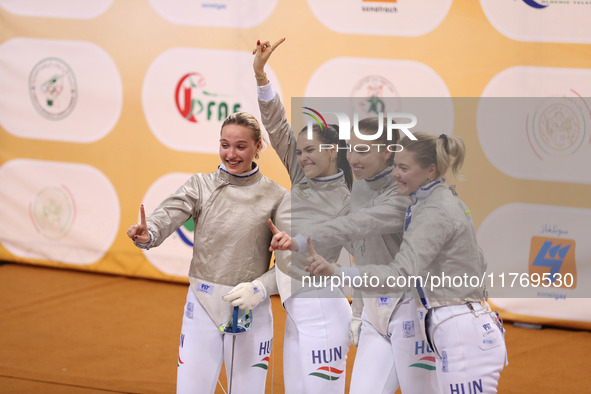 The Hungary Women's Saborie Team reacts after winning first place during the 2024 Fencing World Cup in Oran, Algeria, on November 10, 2024 