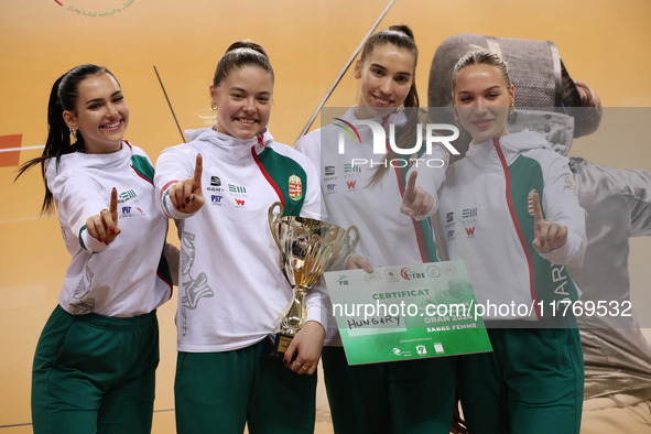 The Hungary Women's Saborie Team reacts after winning first place during the 2024 Fencing World Cup in Oran, Algeria, on November 10, 2024 