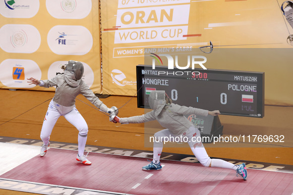 Hungarian Spiesz Anna (left) faces Polish Lenkiewicz Zuzanna (right) during the female saber team final at the 2024 Fencing World Cup in Ora...