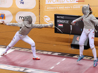 Hungarian Spiesz Anna (left) faces Polish Lenkiewicz Zuzanna (right) during the female saber team final at the 2024 Fencing World Cup in Ora...