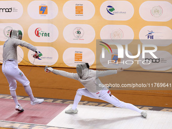 Iranian Baher Arasbaran Farzad (left) confronts Ha Hansol of South Korea (right) during the final of the Male Saber Team event at the 2024 F...