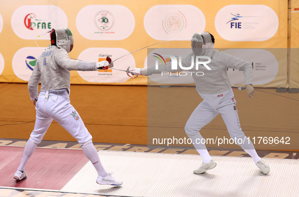 Iranian Baher Arasbaran Farzad (left) confronts Ha Hansol of South Korea (right) during the final of the Male Saber Team event at the 2024 F...