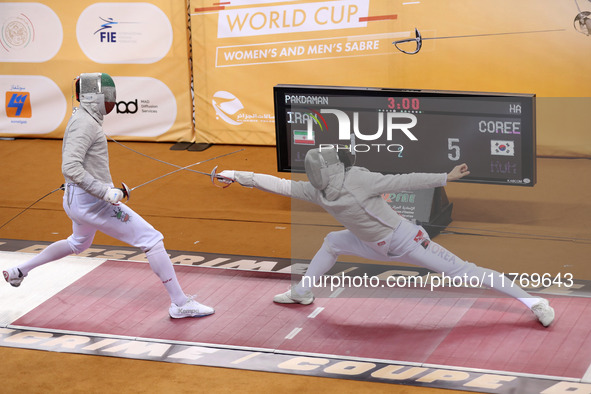 Iranian Baher Arasbaran Farzad (left) confronts Ha Hansol of South Korea (right) during the final of the Male Saber Team event at the 2024 F...