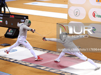 Iranian Baher Arasbaran Farzad (left) confronts Ha Hansol of South Korea (right) during the final of the Male Saber Team event at the 2024 F...