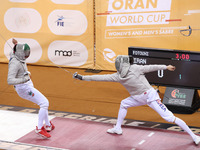 Iranian Baher Arasbaran Farzad (left) confronts Ha Hansol of South Korea (right) during the final of the Male Saber Team event at the 2024 F...