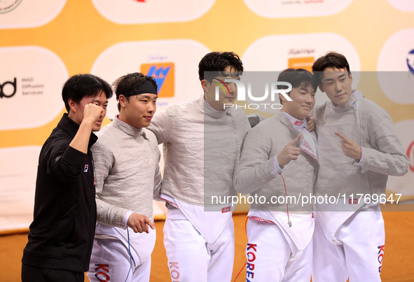 The South Korea men's saber team reacts after winning first place during the 2024 Fencing World Cup in Oran, Algeria, on November 10, 2024. 