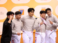 The South Korea men's saber team reacts after winning first place during the 2024 Fencing World Cup in Oran, Algeria, on November 10, 2024....