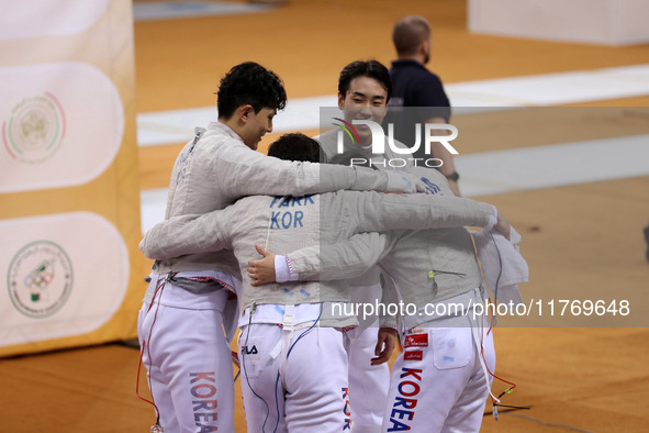 The South Korea men's saber team reacts after winning first place during the 2024 Fencing World Cup in Oran, Algeria, on November 10, 2024. 