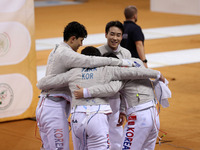 The South Korea men's saber team reacts after winning first place during the 2024 Fencing World Cup in Oran, Algeria, on November 10, 2024....