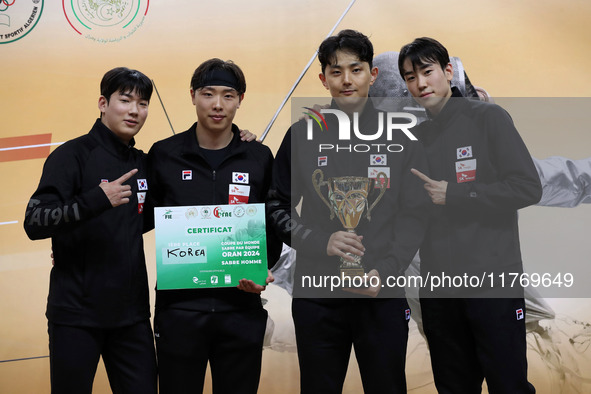 The South Korea men's saber team reacts after winning first place during the 2024 Fencing World Cup in Oran, Algeria, on November 10, 2024. 