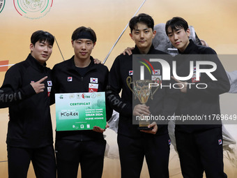 The South Korea men's saber team reacts after winning first place during the 2024 Fencing World Cup in Oran, Algeria, on November 10, 2024....