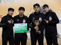 The South Korea men's saber team reacts after winning first place during the 2024 Fencing World Cup in Oran, Algeria, on November 10, 2024....