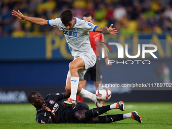 Carlos Martin of Deportivo Alaves competes for the ball with Gueye of Villarreal CF during the LaLiga EA Sports match between Villarreal CF...