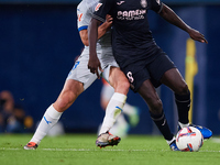 Pepe of Villarreal CF competes for the ball with Antonio Blanco of Deportivo Alaves during the LaLiga EA Sports match between Villarreal CF...