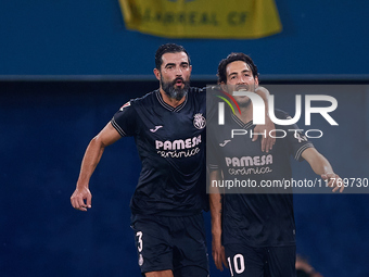 Dani Parejo (R) of Villarreal CF celebrates after scoring the team's second goal with his teammate Raul Albiol of Villarreal CF during the L...