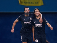 Dani Parejo (R) of Villarreal CF celebrates after scoring the team's second goal with his teammate Raul Albiol of Villarreal CF during the L...