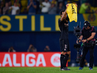 Dani Parejo of Villarreal CF shows a t-shirt supporting the victims of Valencia floodings after scoring the team's second goal during the La...