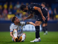 Raul Albiol of Villarreal CF talks with Toni Martinez of Deportivo Alaves during the LaLiga EA Sports match between Villarreal CF and Deport...