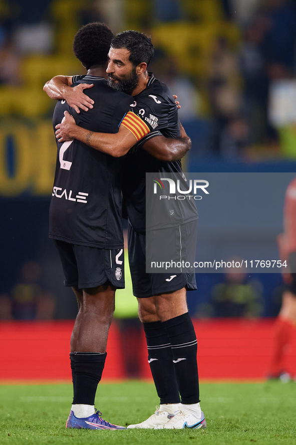 Raul Albiol of Villarreal CF embraces his teammate Logan Evans Costa of Villarreal CF following the LaLiga EA Sports match between Villarrea...