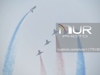 The ''August 1'' aerobatic team of the Chinese Air Force flies a J-10C during a demonstration at the 2024 Zhuhai Air Show in Zhuhai, China,...