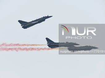 The ''August 1'' aerobatic team of the Chinese Air Force flies a J-10C during a demonstration at the 2024 Zhuhai Air Show in Zhuhai, China,...